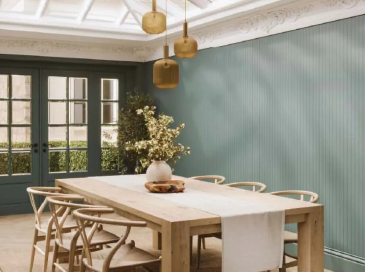 14 Slat Grained Stone Green displayed behind a table - Shower Panels - The Wall Works