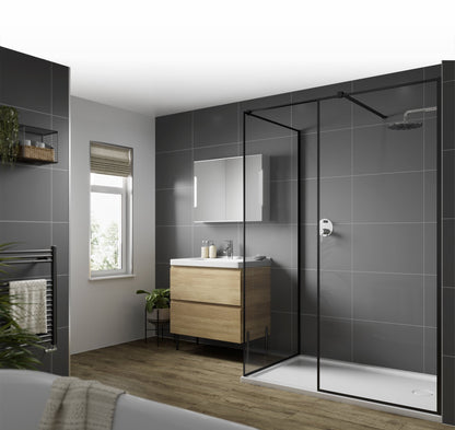 Multipanel Large Tile Dust grey - Shower panels on display around the entire room with the main focal point of the picture being the grey wall panels in the shower with the matching black shower accessories with a mirror to the left of the shower mountedf to the wall. There is a bath just edging into the photo, facing more wall panels with a towel rack - shower panels - The Wall Works