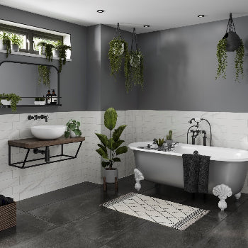 Multipanel Monument Grey Metro on display behind a bathtub, with shower panels and plants surrounding the room. A wall-mounted sink showcases the modern look, and the wall panels help capture the contemporary essence - shower panels - The Wall Works