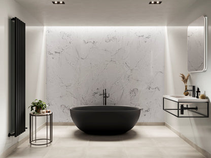 Multipanel Unlipped Onyx Marble on display with qa black radiator and a matching black bath matching the black lines in the shower panels - wall panels - The Wall Works
